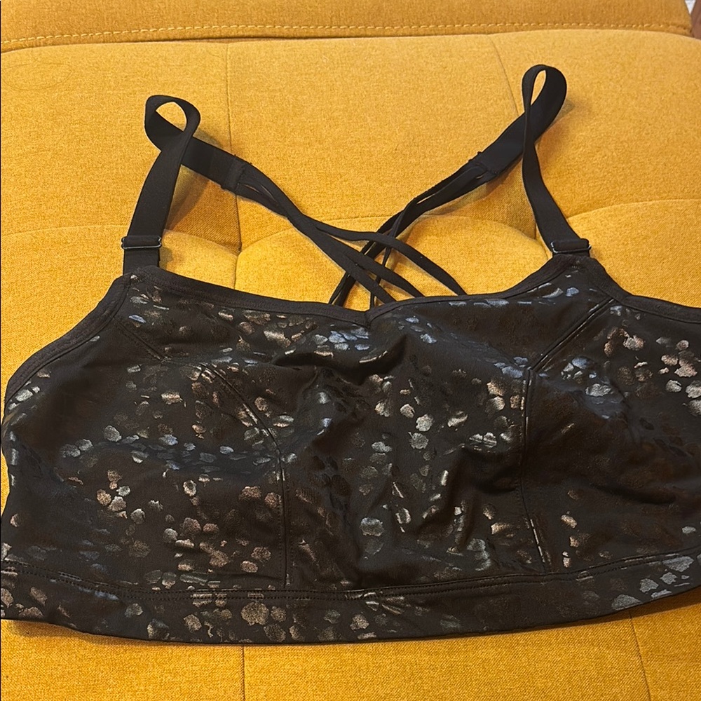 Black sports bra with design on it . Size 14/16 new without a tag
